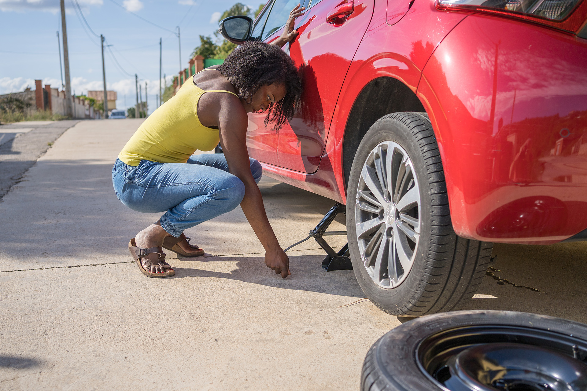 girl changing a tire