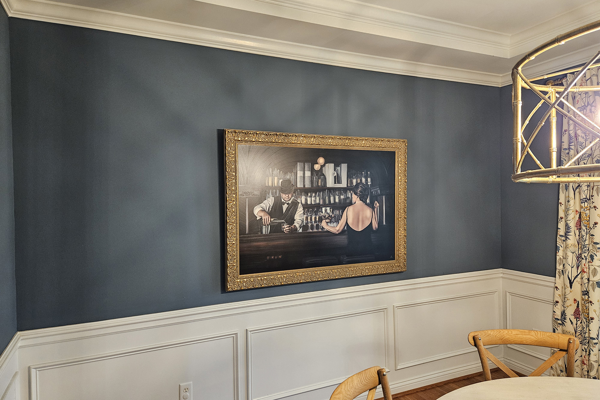 Commised piece of art hanging on a wall in the luxury home dining room