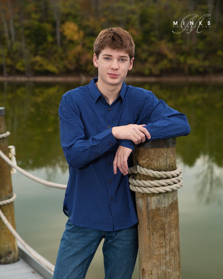 senior guy standing on a dock