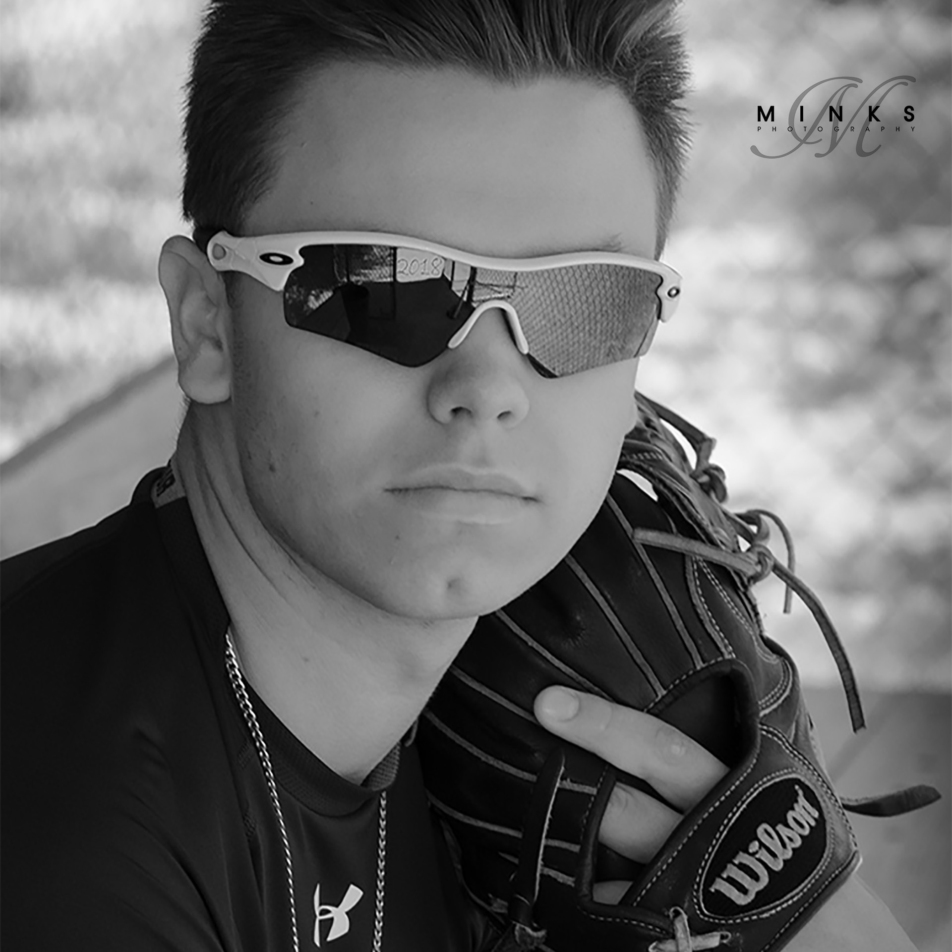 guy senior picture with baseball glove black and white