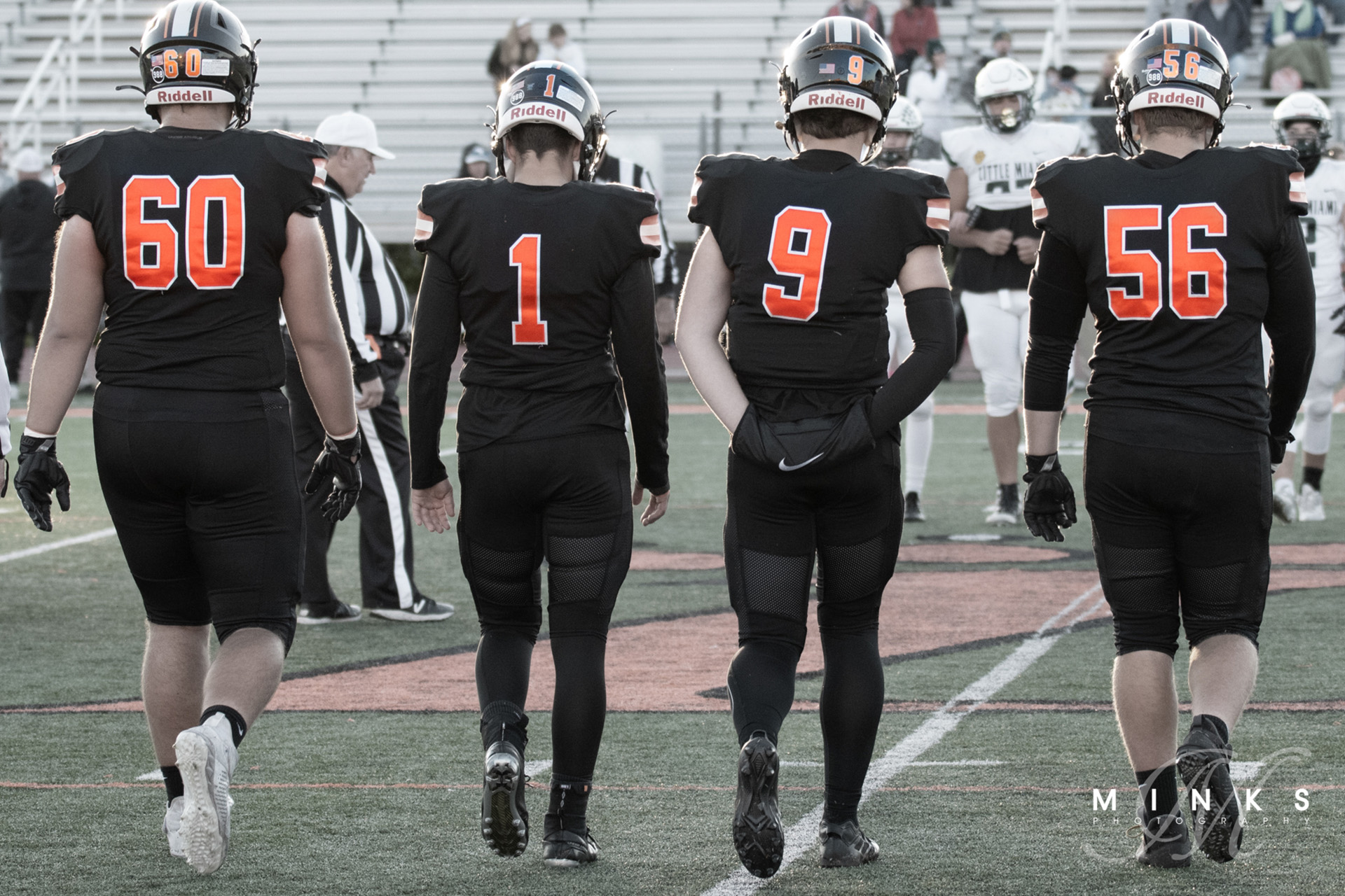 Loveland Ohio high school football captains walking on field for coin toss