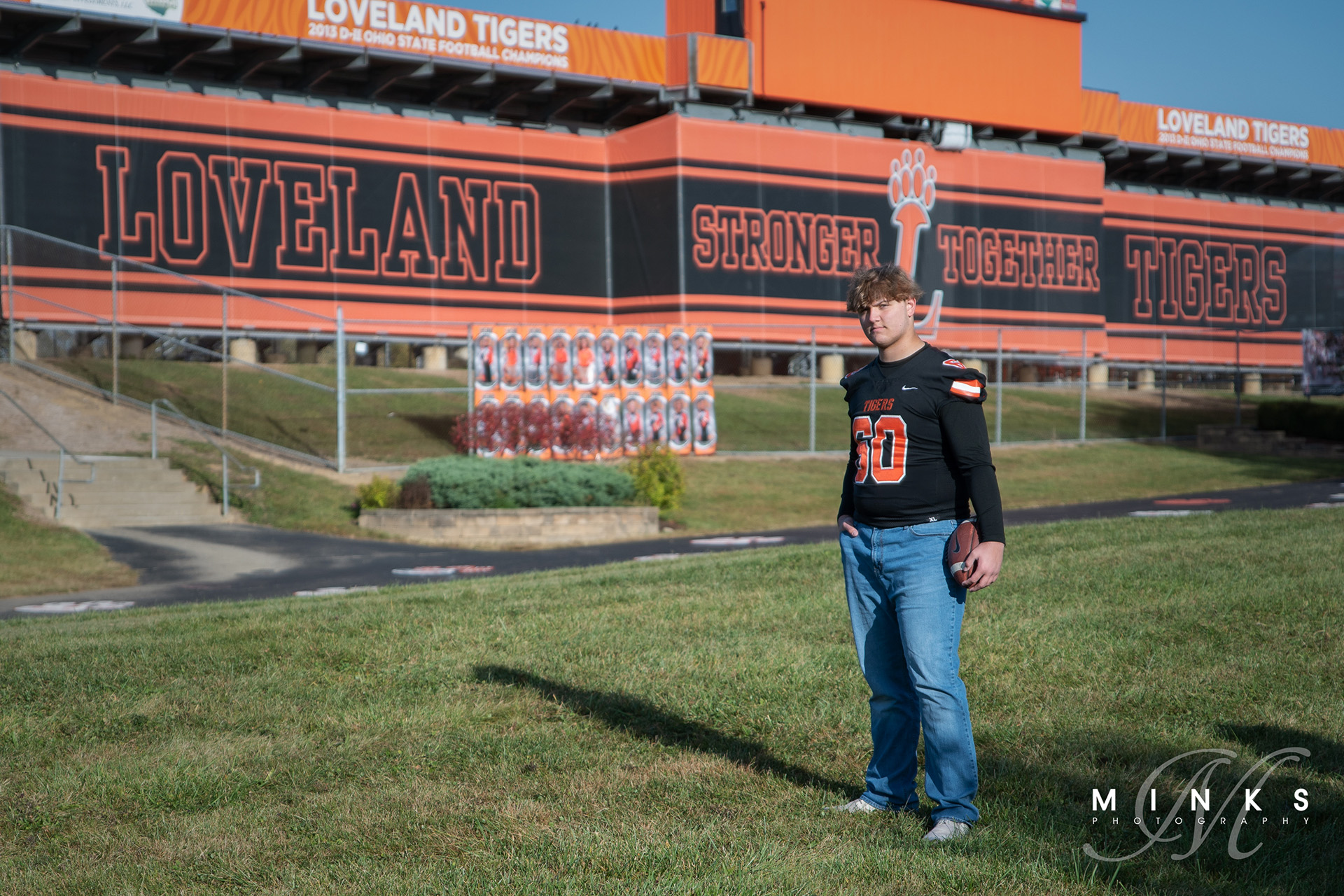 loveland ohio football player standing outside of stadium