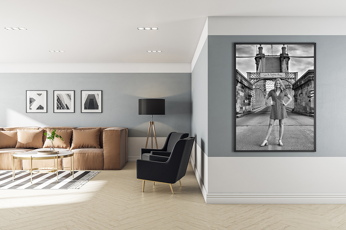 modern living room with large black and white picture of senior girl hanging on the wall