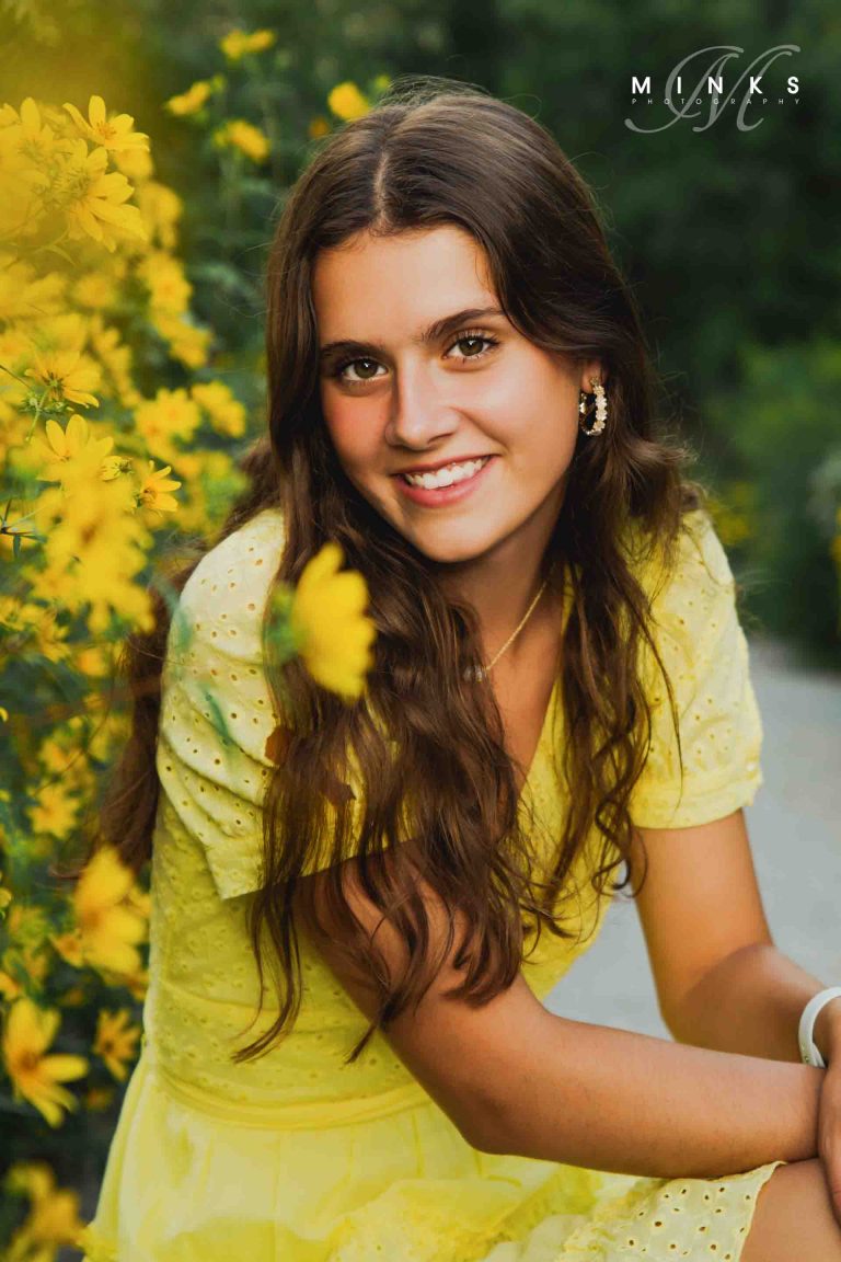 senior girl with yellow wildflowers