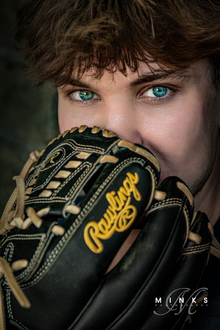 Senior guy with baseball glove and amazing blue eyes
