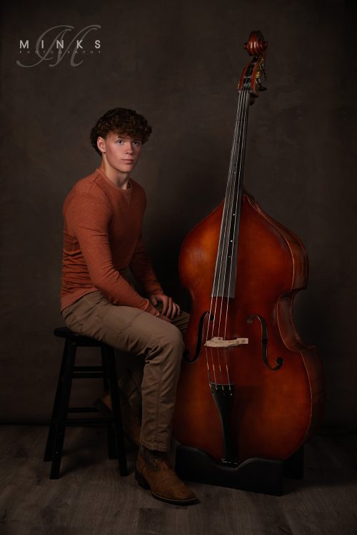 senior portrait of guy with double bass